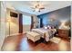 Comfortable bedroom with hardwood floors, a ceiling fan, and exercise equipment at 2805 Ponkan Meadow Dr, Apopka, FL 32712