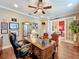Well-lit home office with French doors, built-in storage, and classic decor for a professional atmosphere at 2805 Ponkan Meadow Dr, Apopka, FL 32712