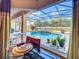 View of the screened pool from the dining area, showcasing the outdoor living space at 2805 Ponkan Meadow Dr, Apopka, FL 32712