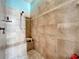 Detailed tile shower features built in bench and shampoo nook; with a hand held shower head at 2805 Ponkan Meadow Dr, Apopka, FL 32712