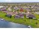 Beautiful aerial view of homes with backyard pools on a waterfront property in a lush community at 2819 Boating Blvd, Kissimmee, FL 34746
