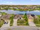 Scenic aerial view of homes on a tranquil waterfront in a well-maintained residential community at 2819 Boating Blvd, Kissimmee, FL 34746