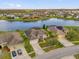 Stunning aerial view of waterfront houses in a beautiful community with lush green lawns at 2819 Boating Blvd, Kissimmee, FL 34746