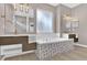 Bright bathroom featuring double sinks, luxurious soaking tub, and modern lighting fixtures at 2819 Boating Blvd, Kissimmee, FL 34746