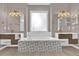 Luxurious bathroom with double vanities, decorative tile, and a large soaking tub at 2819 Boating Blvd, Kissimmee, FL 34746