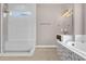 Bright bathroom featuring soaking tub, walk-in shower with window, and modern vanity at 2819 Boating Blvd, Kissimmee, FL 34746