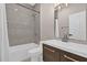 Modern bathroom featuring a shower/tub, decorative mirror, and sleek vanity at 2819 Boating Blvd, Kissimmee, FL 34746