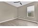 Neutral bedroom with hardwood floors and a window allowing for plenty of natural light at 2819 Boating Blvd, Kissimmee, FL 34746