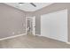 Neutral bedroom featuring hardwood floors, large closet, and en-suite bathroom at 2819 Boating Blvd, Kissimmee, FL 34746