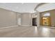 Bright open-concept living room with hardwood floors, elegant lighting, and a view of the front door at 2819 Boating Blvd, Kissimmee, FL 34746