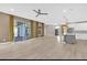 Bright open-concept living room and kitchen with hardwood floors and access to the lanai at 2819 Boating Blvd, Kissimmee, FL 34746