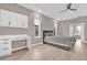 Neutral primary bedroom featuring neutral walls, desk, and ceiling fan at 2819 Boating Blvd, Kissimmee, FL 34746