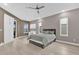 Spacious primary bedroom featuring neutral walls, ceiling fan, and sliding doors to lanai at 2819 Boating Blvd, Kissimmee, FL 34746