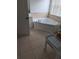 Corner tub in a well-lit bathroom with tile flooring and a window at 2836 Club Cortile Cir, Kissimmee, FL 34746