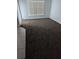 A clean bedroom with cozy carpeting and natural light from the window at 2836 Club Cortile Cir, Kissimmee, FL 34746