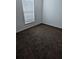 Neutral bedroom with plush carpeting and a bright window at 2836 Club Cortile Cir, Kissimmee, FL 34746