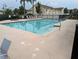 Sparkling community pool with lounge chairs, perfect for relaxing and enjoying the Florida sunshine at 2836 Club Cortile Cir, Kissimmee, FL 34746