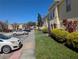 Well-maintained townhome community with manicured lawns, lush landscaping, and ample parking at 2836 Club Cortile Cir, Kissimmee, FL 34746