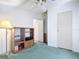 Bright bedroom featuring neutral walls, an open closet, and a ceiling fan at 33 Florence Blvd, Debary, FL 32713