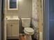 This is a bathroom with wood-look flooring and a shower with a curtain at 3651 N Goldenrod Rd # 210, Winter Park, FL 32792
