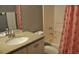 Bathroom featuring tiled shower and tub combination with modern vanity at 3651 N Goldenrod Rd # 210, Winter Park, FL 32792
