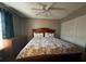 Charming bedroom features a ceiling fan, a large bed and a dresser at 3651 N Goldenrod Rd # 210, Winter Park, FL 32792