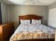 Charming bedroom features a ceiling fan, a large bed and a dresser at 3651 N Goldenrod Rd # 210, Winter Park, FL 32792