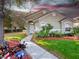 Charming single-story home featuring manicured landscaping and a welcoming walkway leading to the front door at 3967 Campfire Way, Casselberry, FL 32707