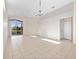 Bright, open living space with tile flooring, sliding glass doors, and plenty of natural light overlooking the lake at 3967 Campfire Way, Casselberry, FL 32707