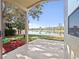 Scenic patio view overlooking the lake and lush greenery at 3967 Campfire Way, Casselberry, FL 32707
