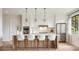 Modern kitchen with a large island, stainless steel appliances, and sleek white cabinetry at 405 Calhoun Pl, Orlando, FL 32801