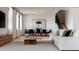 Open-concept living room with modern furniture, hardwood floors, and plenty of natural light at 405 Calhoun Pl, Orlando, FL 32801