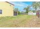 Property with a large backyard, storage shed, and mature trees offering privacy at 410 South Hudson St, Orlando, FL 32835