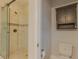 Nicely designed bathroom with tiled shower, glass door, and white toilet at 410 South Hudson St, Orlando, FL 32835