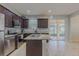 Contemporary kitchen with granite countertops, stainless steel appliances, and a seamless transition to the outdoor patio at 410 South Hudson St, Orlando, FL 32835