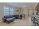 Cozy living room with leather seating, tile floors, and abundant natural light creating a warm and inviting atmosphere at 410 South Hudson St, Orlando, FL 32835