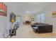 Spacious living room with tile flooring, natural light, and seamless flow to the dining area, great for entertaining at 410 South Hudson St, Orlando, FL 32835