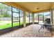 Covered patio with a brick floor, screened windows, and a view to the backyard and shed at 410 South Hudson St, Orlando, FL 32835