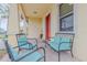 Inviting front porch featuring comfortable seating, perfect for relaxing and enjoying the neighborhood view at 410 South Hudson St, Orlando, FL 32835