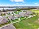 Community aerial view highlighting yards, green spaces, houses, and nearby lake at 432 Tallow Wood Cir, Debary, FL 32713