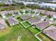 Aerial view of the community highlighting houses, backyards, and green spaces at 432 Tallow Wood Cir, Debary, FL 32713