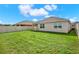 Spacious backyard featuring a green lawn and full white vinyl perimeter fence at 432 Tallow Wood Cir, Debary, FL 32713