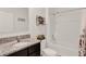 Bathroom with granite vanity, white cabinets and bathtub/shower combo with curtain at 432 Tallow Wood Cir, Debary, FL 32713
