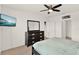 Bedroom with a large dresser, TV, and comfortable queen bed at 432 Tallow Wood Cir, Debary, FL 32713