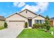 Charming single-story home featuring a two-car garage and a well-manicured lawn at 432 Tallow Wood Cir, Debary, FL 32713