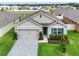 Inviting single-story home with a spacious driveway, manicured lawn, and charming blue shutters at 432 Tallow Wood Cir, Debary, FL 32713