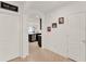 Hallway featuring tile flooring, white walls and door trim, and stylish decor at 432 Tallow Wood Cir, Debary, FL 32713