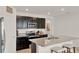 Open kitchen with granite countertops, stainless steel appliances, and a breakfast bar with seating at 432 Tallow Wood Cir, Debary, FL 32713