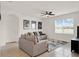 Comfortable living room featuring neutral decor, a ceiling fan, and ample natural light at 432 Tallow Wood Cir, Debary, FL 32713