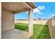 View of a covered patio and backyard with a white vinyl fence at 432 Tallow Wood Cir, Debary, FL 32713